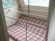 The bed will be at window height on those bars underneath will be storage (curtained off)